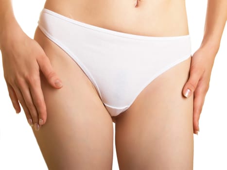 Part of a female body in cowards on a white background