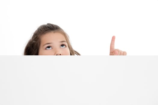 Cute Caucasian girl holding a blank sign