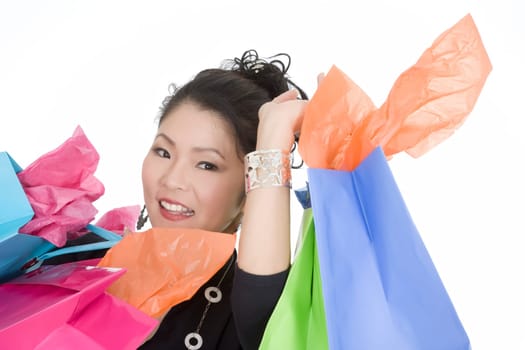 Beautiful and sexy Asian woman carrying shopping bags