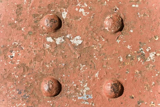 Close up of wrought iron structure that has been hot riveted