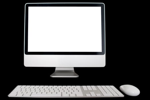 White Monitor, keyboard and mouse isolated over black background