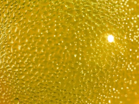 Water droplets formed from condensation inside a bottle gold tone