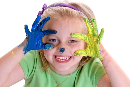Young Child (Girl) smiles after painting session with colorful hands