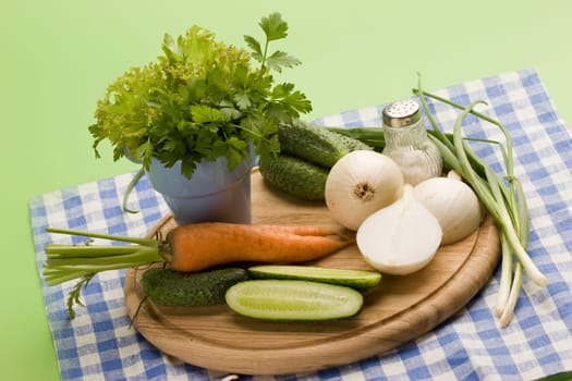 fresh vegetables: onion, carrot, cucumber and parsley