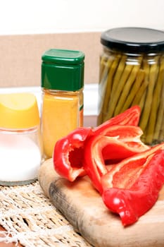 Cutting pepper into small slices.