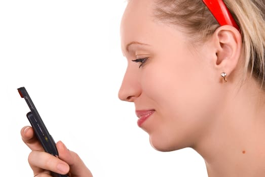 Girl in red hair band with mobile phone on white