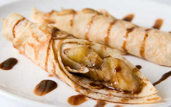 pancake dessert at plate isplated on white. Close-up.
