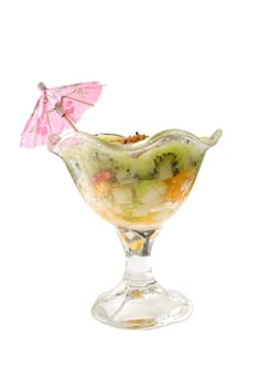 Tasty dessert with kiwi and nuts on white
