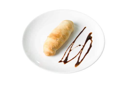 sweet bun with chocolate at plate isolated on a white