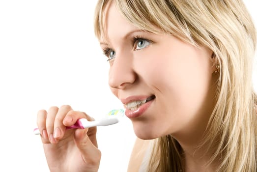 Young beautiful woman brush her teeth