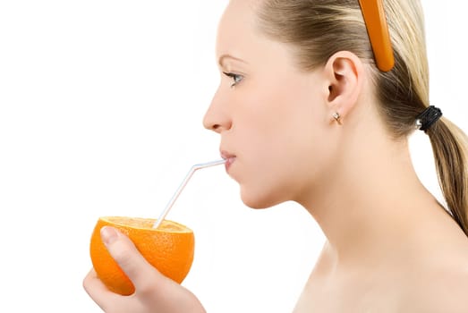 Pretty girl drink orange juice on white