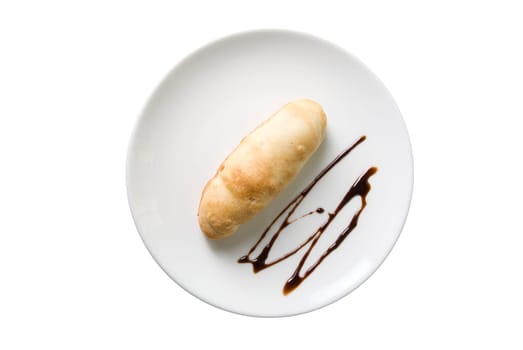 sweet bun with chocolate at plate  isolated on a white