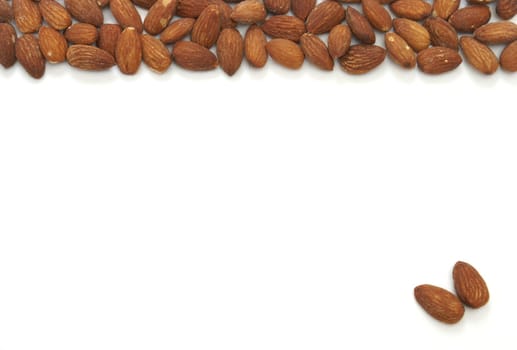 An almond pile at the top and two seperate almonds on the bottom.
