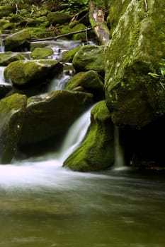 nice scenic view of a waterfall with silky smooth water