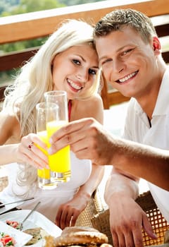 man and woman having breakfast