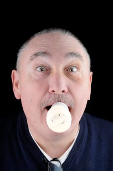The way of the future of ecological conservation using less energy in a humorus manner with a man with a flourescent bilb in his mouth alight!!