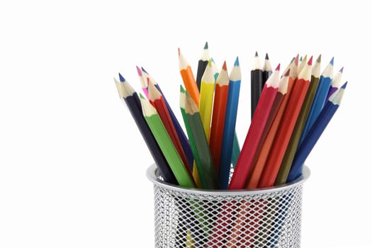 Colored pencils in metal office pencil holder isolated on white background