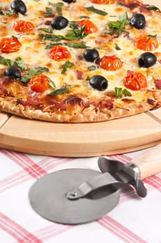 baked pizza served on wooden board