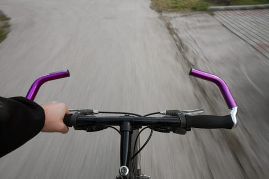 Ridin a bicycle on an asphalt road