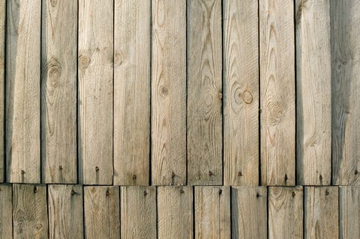 It is a brown wooden wall, background of vintage architecture