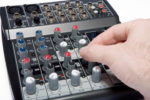 A professional audio / disk jockey / karaoke mixer on a white background