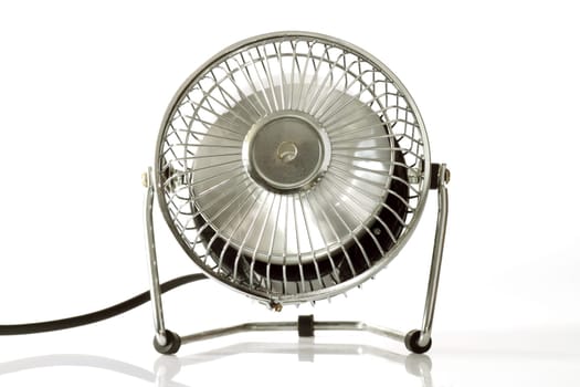 Electric silver fan  on bright background