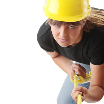 Young woman builder holding yellow rope