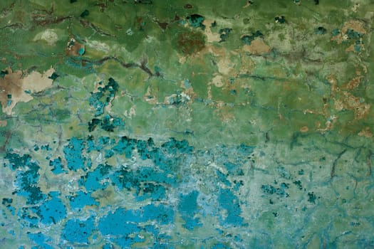 Surface of an old decayed color wall with cracks