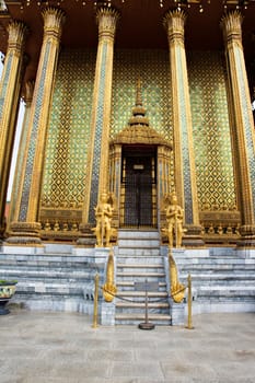 Traditional structures decorated in gold at the Grand Palace in Bangkok Thailand