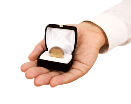 Man offering a coin in jewelry gift box - business concept