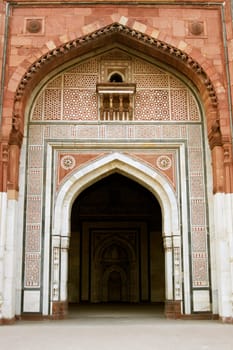Ornate entrance to the ancient mosque (Qal'a-i-Kuhna) inside the historic fort of Purana Qila in Delhi, India. 16th Century AD.