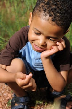 African American child playing in a meadow