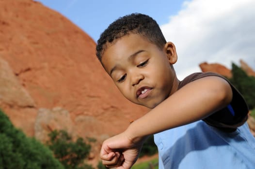African American child playing in a meadow