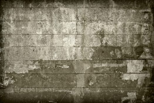 Surface of the old, brown wall covered with boards