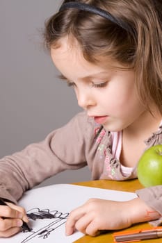 Little girl drawing a picture