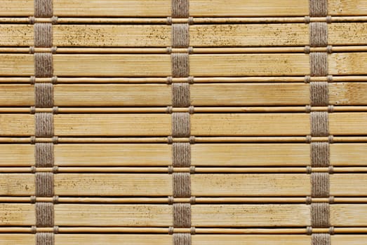 Brown woven wooden background tied with cords