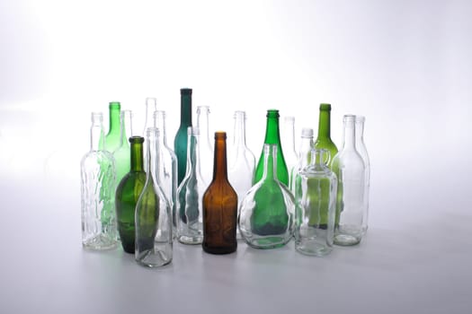 color glass bottles on the white background