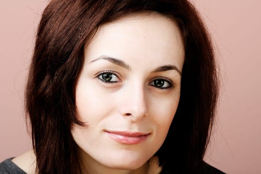 Portrait of a happy beautiful woman with green eyes.