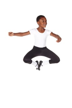 Young African ballet boy on white background and floor showing various ballet steps and positions. Not Isolated