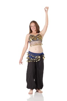 Young Caucasian belly dancing girl in beautiful decorated clothes on white background and reflective floor. Not isolated