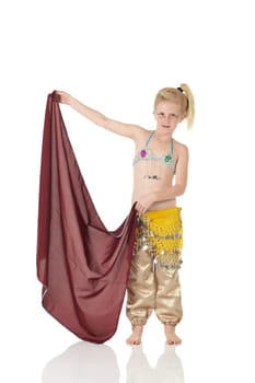Young Caucasian belly dancing girl in beautiful decorated clothes on white background and reflective floor. Not isolated