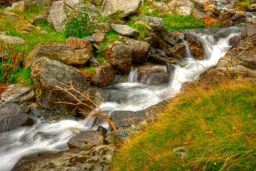 beautiful cascade in the morning light,  HDR. Long exposure time gives an "out of time"" feeling."