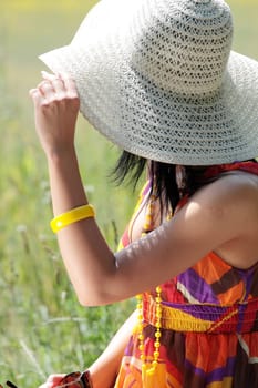 Young happy woman in green grain field