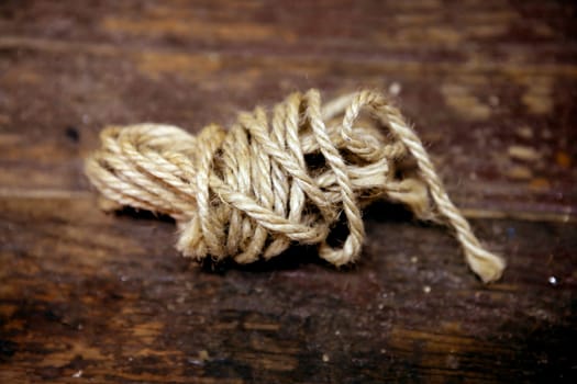 Thread old spool over an aged brown wooden surface