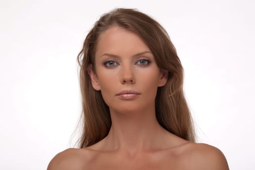 Portrait close up of the young woman of the European type with blue eyes, on a white background