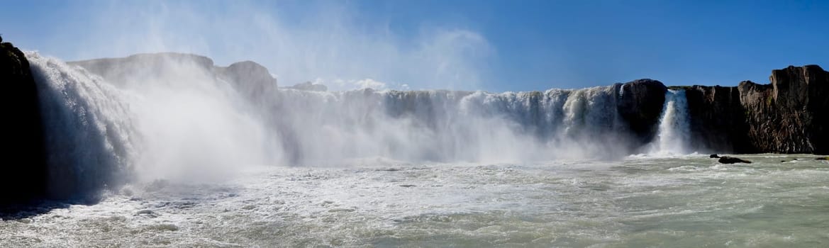 Panoramic photograph of Godafoss waterfall in Iceland, taken at water level.