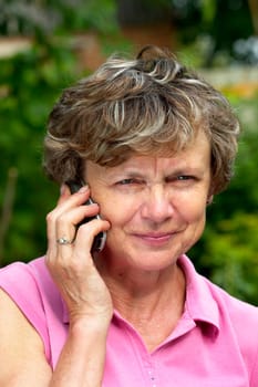 Senior on call in the garden