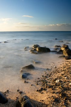 It is sunset of beautiful coral reef coastline.