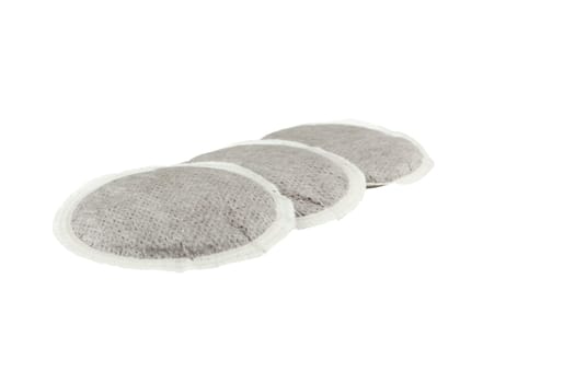 group of three coffee pads isolated on white