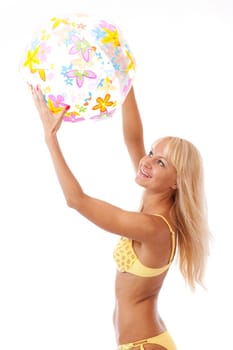 pretty long hair blond woman in yellow bikini with ball